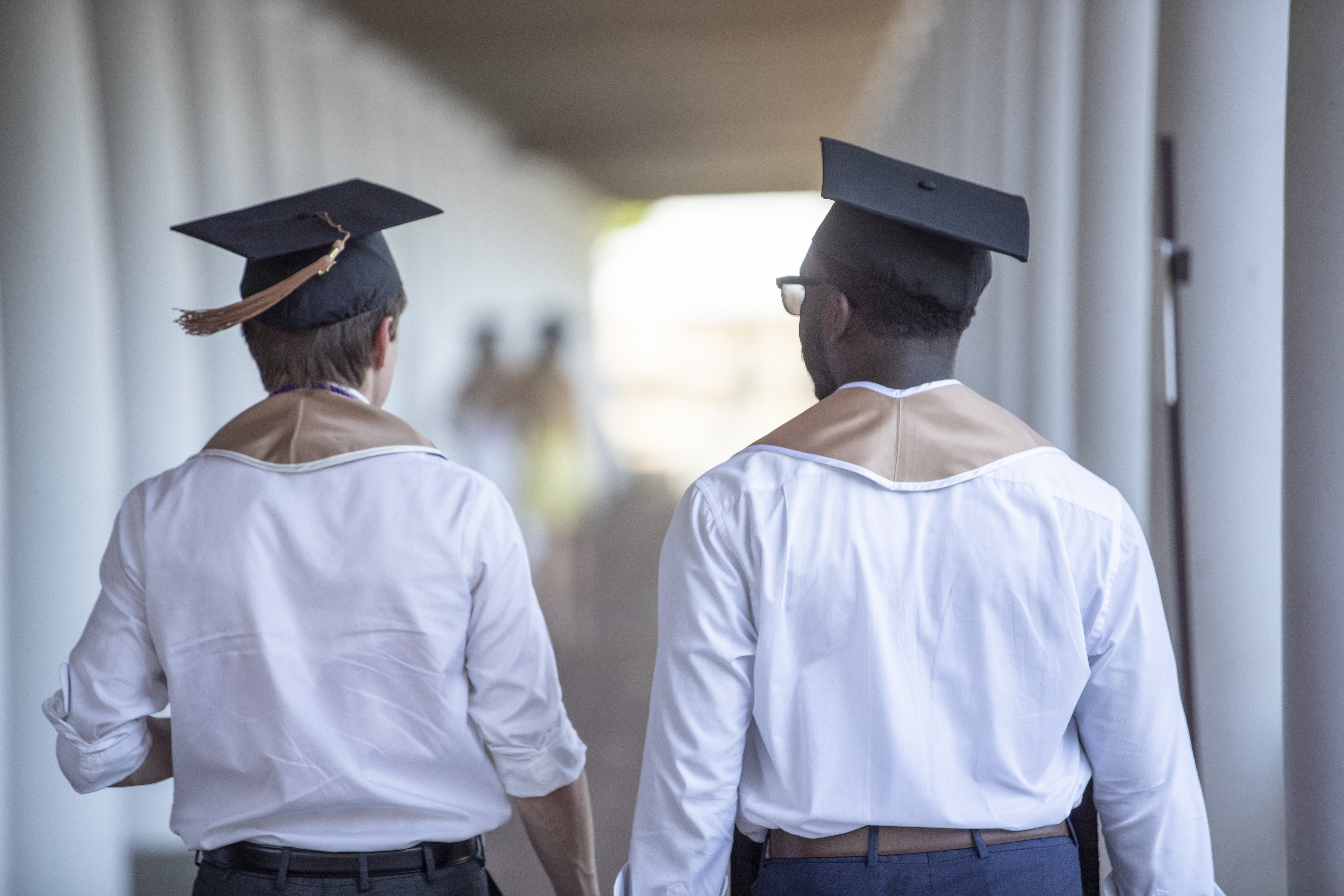 Two students dressed for final exercises